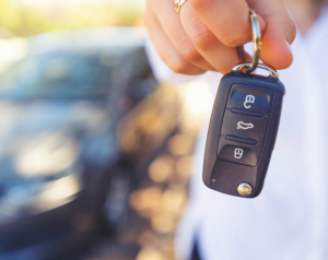 A man holding car keys